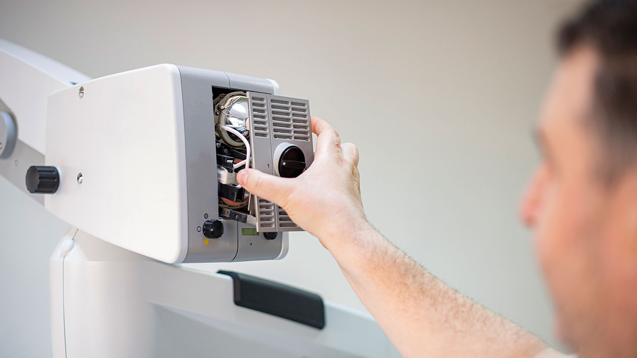 Technician fixing a medical device